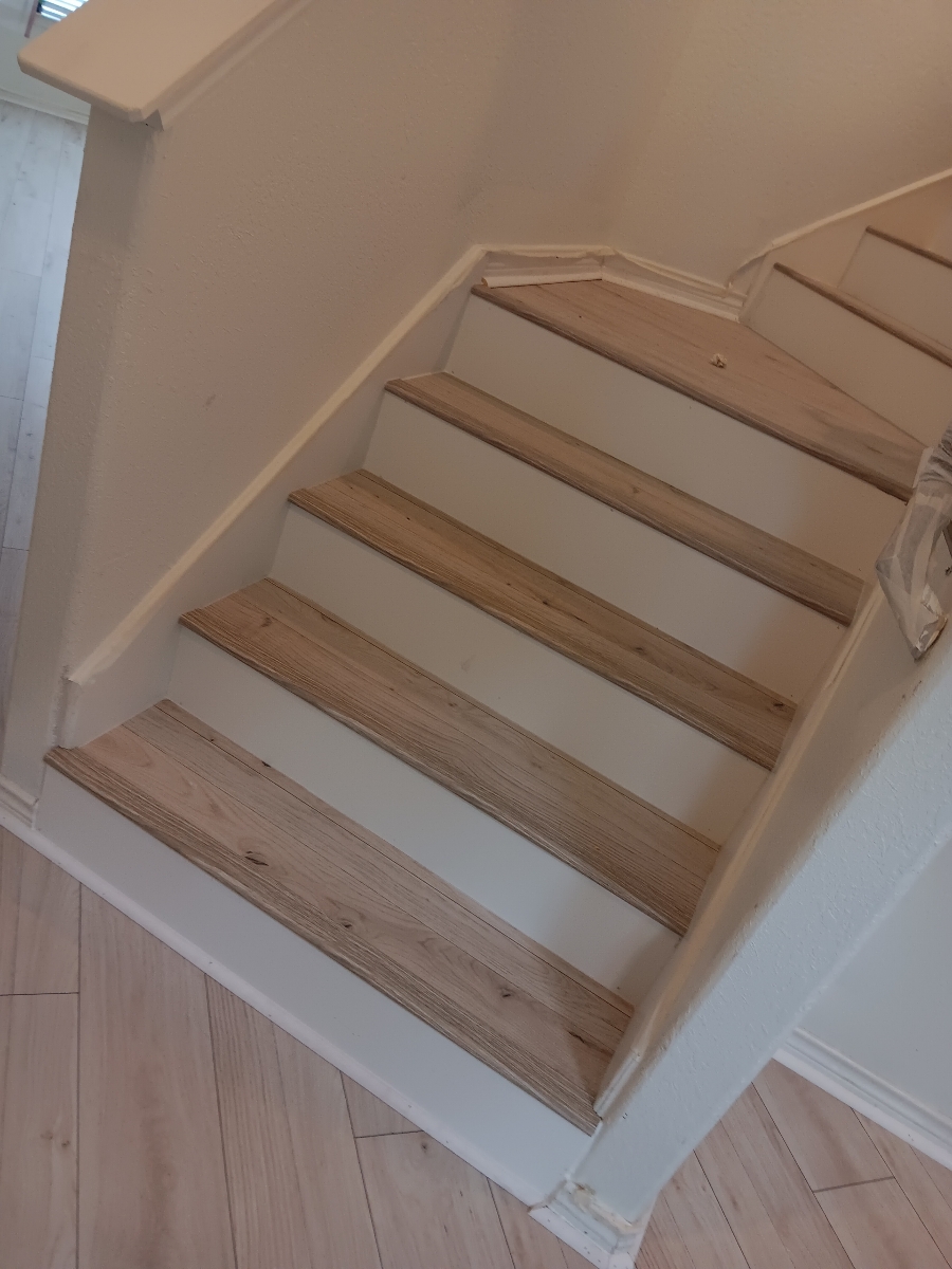 light colored vinyl flooring staircase with white risers, wfa's custom hardwood floors, houston texas